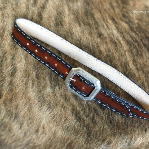 Tooled leather belt with white stitching